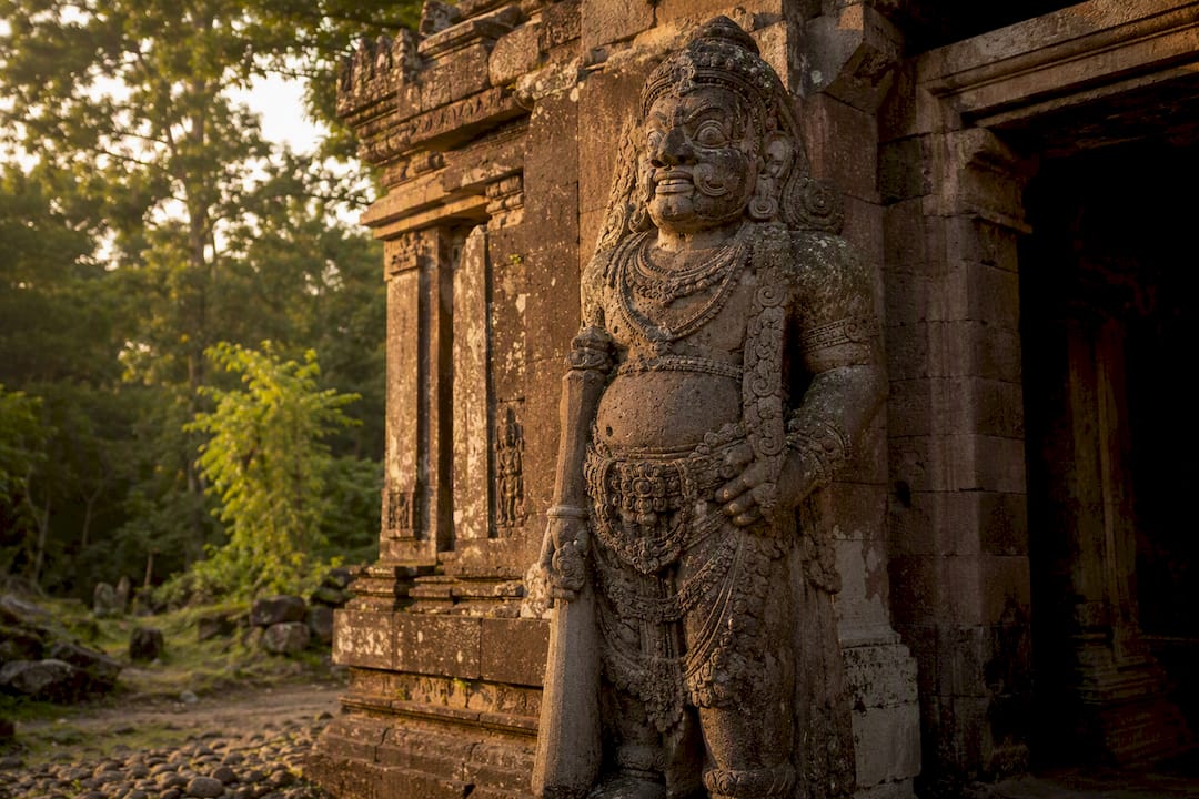 Stone dvarapala guardian at temple entrance